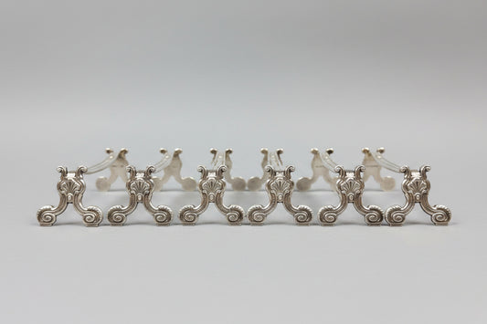 Christofle, suite de 6 porte-couteaux modèle coquille