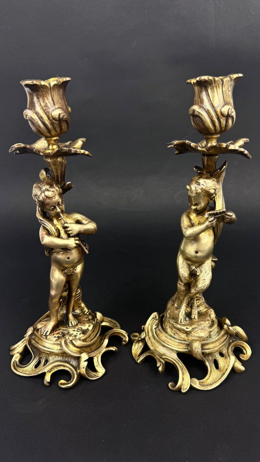 Paire de bougeoirs en bronze doré, putti, faune XIXème siècle