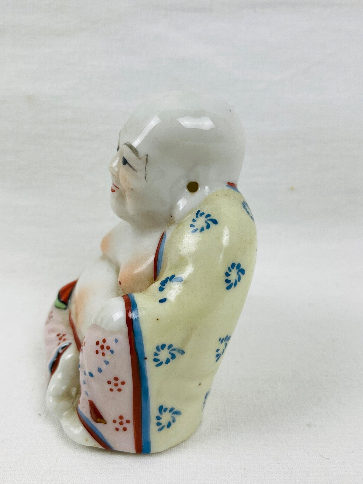 Bouddha rieur en porcelaine