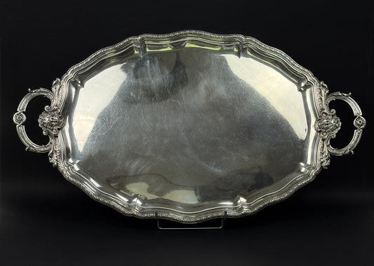 Christofle, important plateau de service en métal argenté décor de mascarons