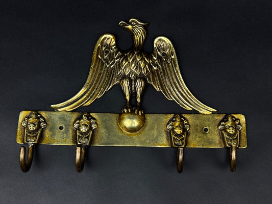 Patère murale en bronze à décor d’aigle et mascarons – style Empire