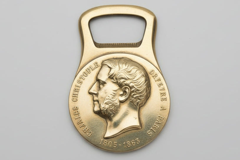 Décapsuleur Christofle métal doré à l’effigie de Charles Christofle – avec boîte d’origine